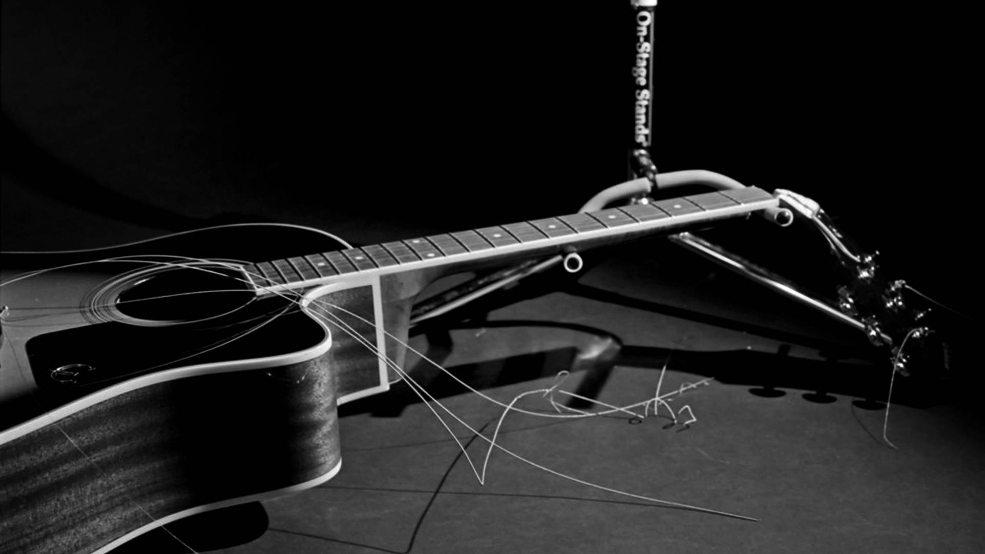 guitar with broken strings